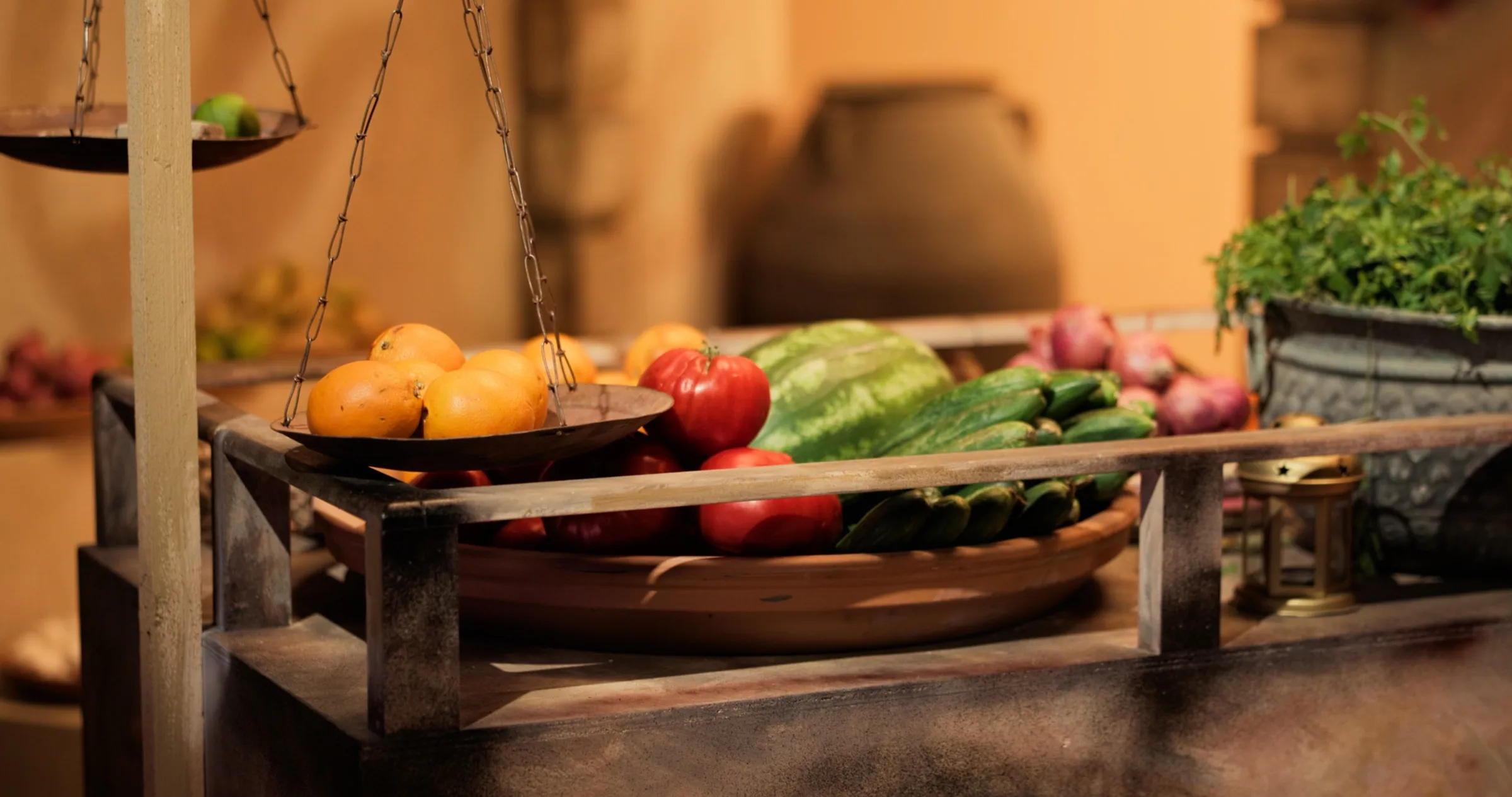 Fresh vegetables and produce styled on a rustic wooden board