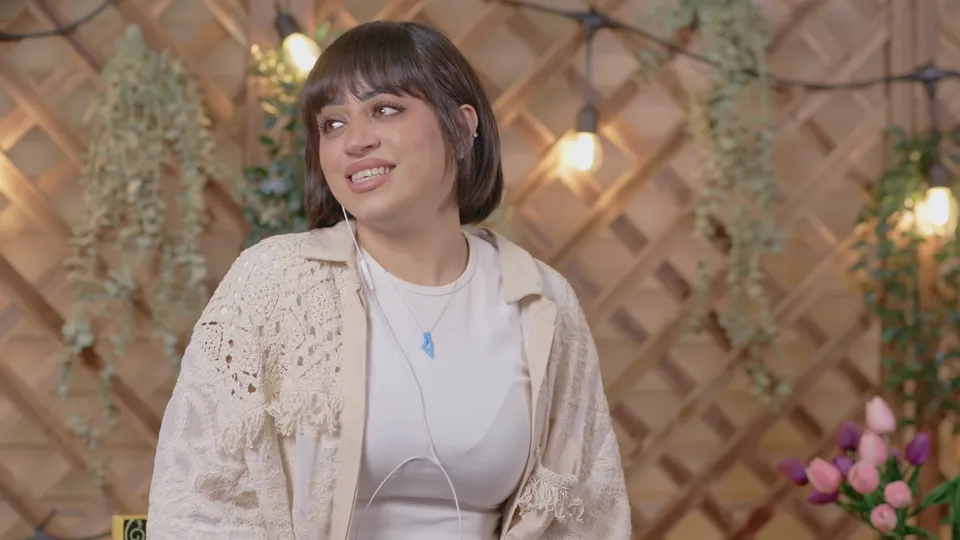 Still from Interview — garden setting